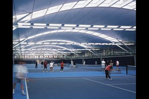 The roof vault curves gracefully over the six indoor courts just like a tennis ball in flight